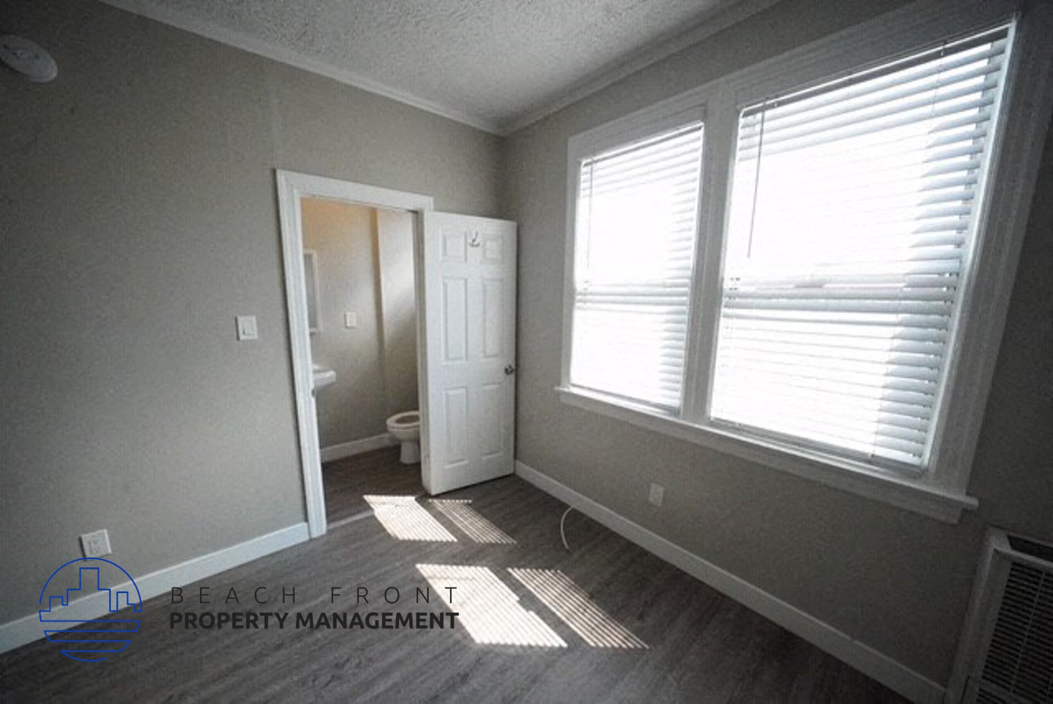 a view of a room with windows and a door